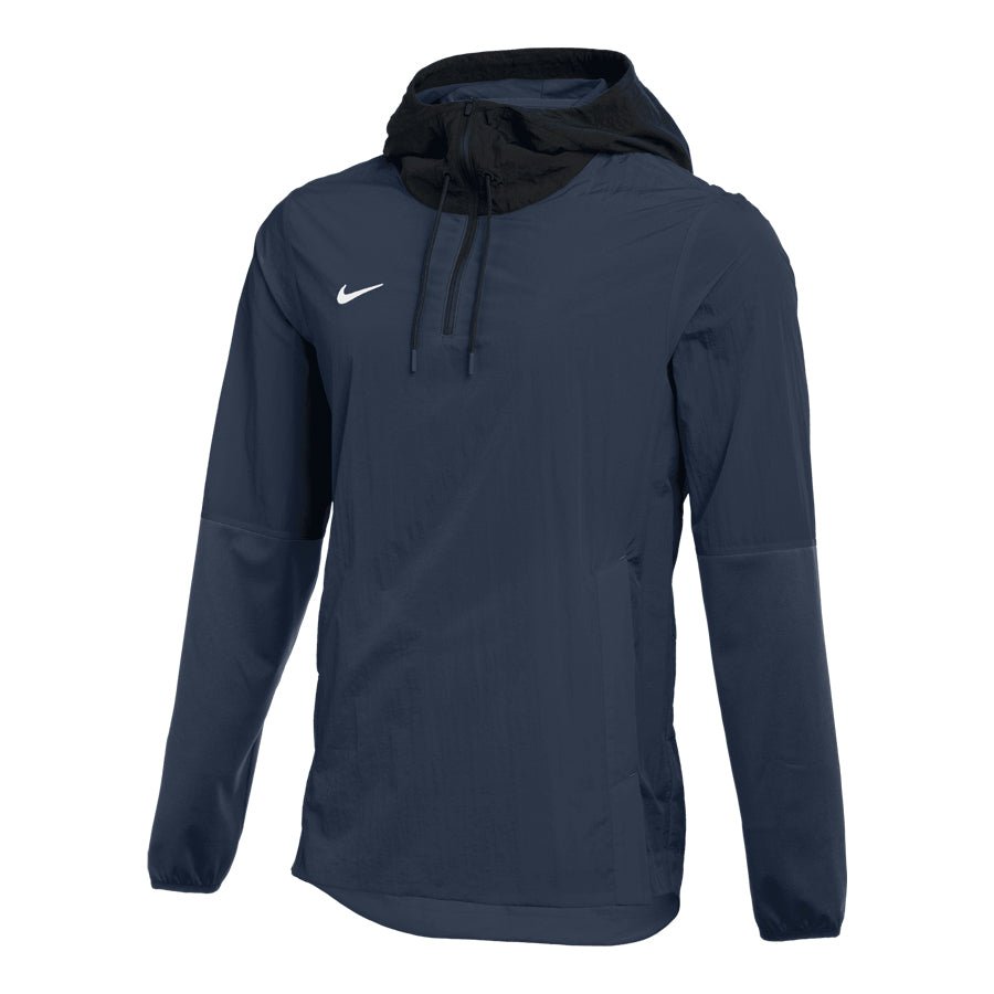 The Nike Team Player Jacket, crafted by Nike in a sleek navy blue color, provides lightweight coverage and features an oversized drawstring hood. The jacket is stylishly completed with a prominent white swoosh logo on the chest and long sleeves.